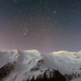 mountain covered snow under star
